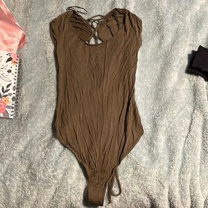Free people body suit never worn been in closet for years.